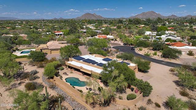 birds eye view of property featuring a mountain view