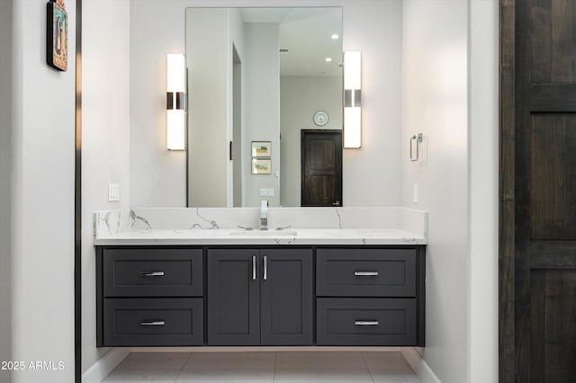 bathroom featuring tile patterned flooring and vanity