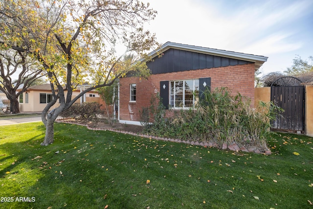 view of property exterior with a lawn