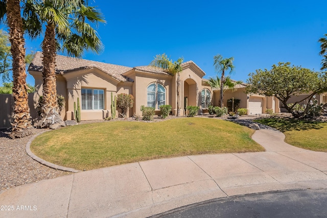 view of front facade featuring concrete driveway, stucco siding, an attached garage, a tiled roof, and a front lawn
