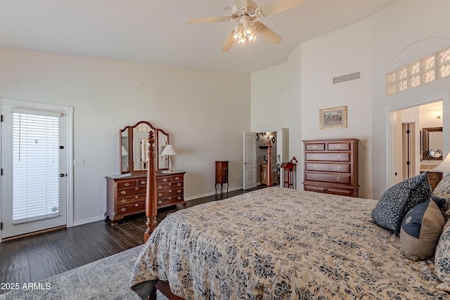 bedroom with baseboards, dark wood-style flooring, ceiling fan, and visible vents