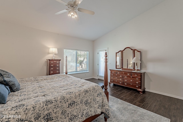 bedroom with baseboards, lofted ceiling, wood finished floors, and a ceiling fan
