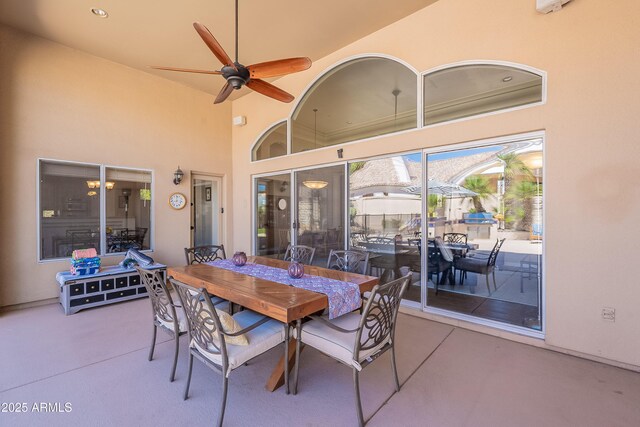 view of patio featuring outdoor dining area and a ceiling fan