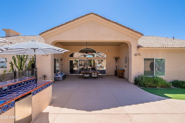 view of patio with ceiling fan