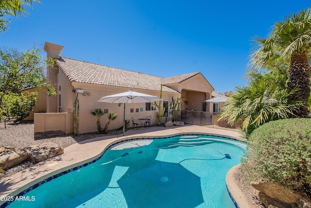 view of pool featuring a patio and a fenced in pool