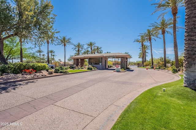 mid-century modern home featuring curved driveway