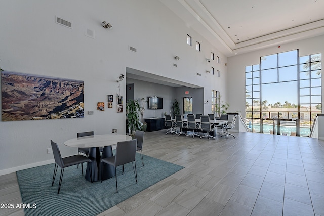 dining space with baseboards and visible vents