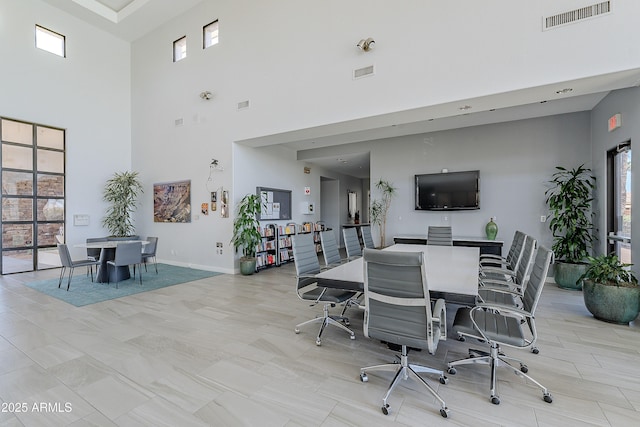 interior space featuring baseboards and visible vents