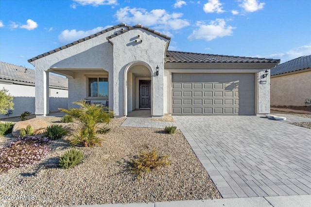 view of front of property with a garage