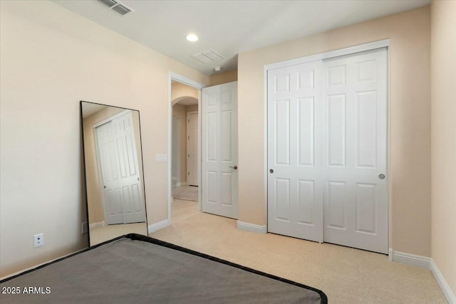 unfurnished bedroom featuring light colored carpet