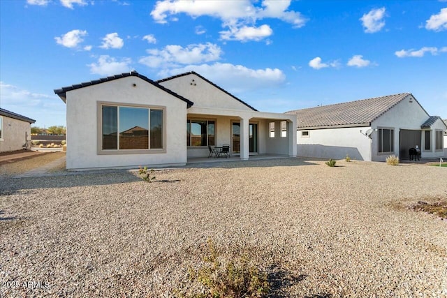 rear view of property with a patio area