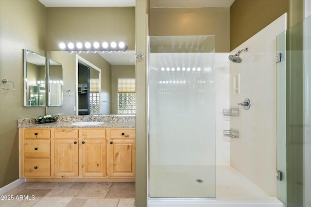 full bathroom featuring walk in shower and vanity