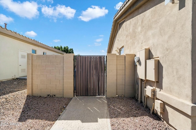 view of gate with fence