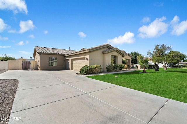 mediterranean / spanish-style home featuring stucco siding, concrete driveway, an attached garage, a front yard, and a tiled roof