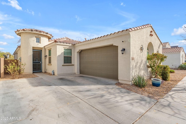 mediterranean / spanish-style house featuring a garage