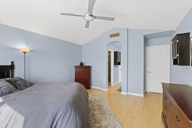 bedroom featuring light wood-type flooring, ceiling fan, and lofted ceiling