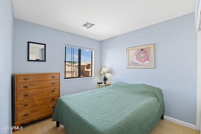 bedroom featuring light wood-type flooring