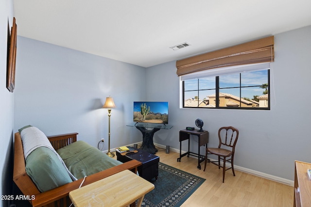 living area with light hardwood / wood-style floors