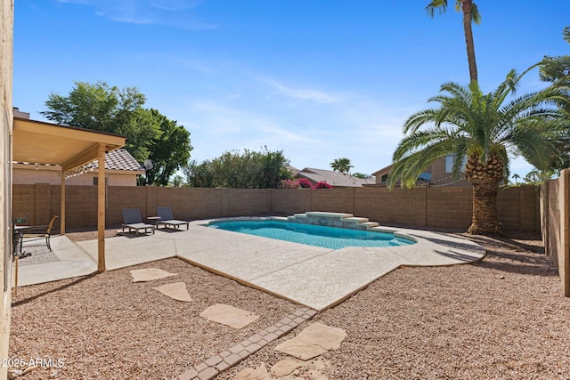 view of swimming pool with a patio area