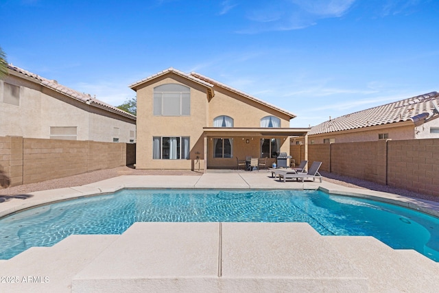 view of swimming pool with a patio area