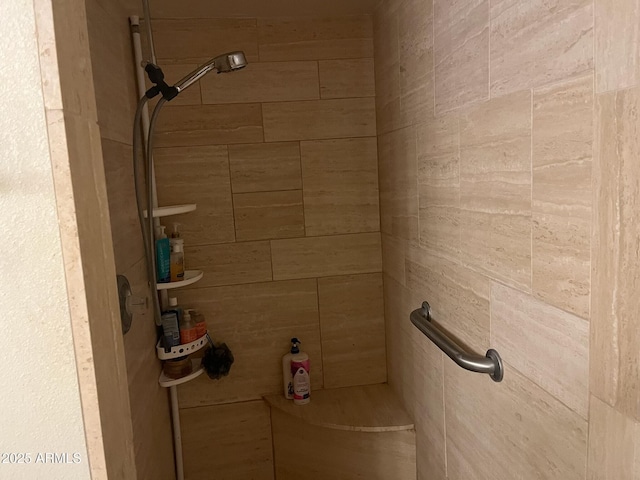 bathroom with tiled shower