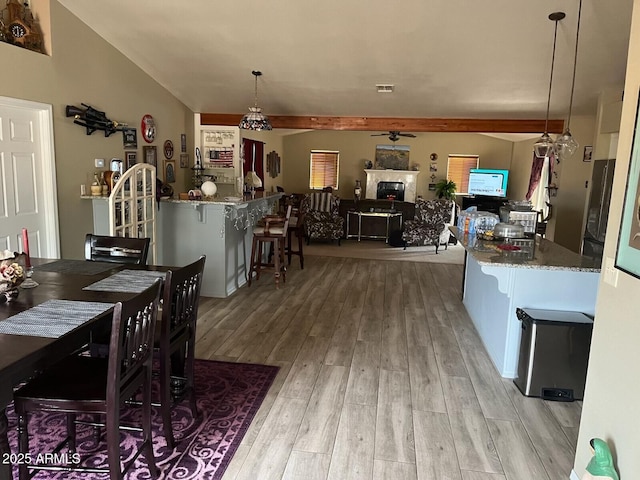 dining space with light hardwood / wood-style floors