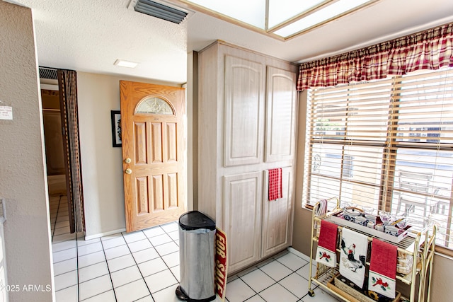 interior space featuring a textured ceiling