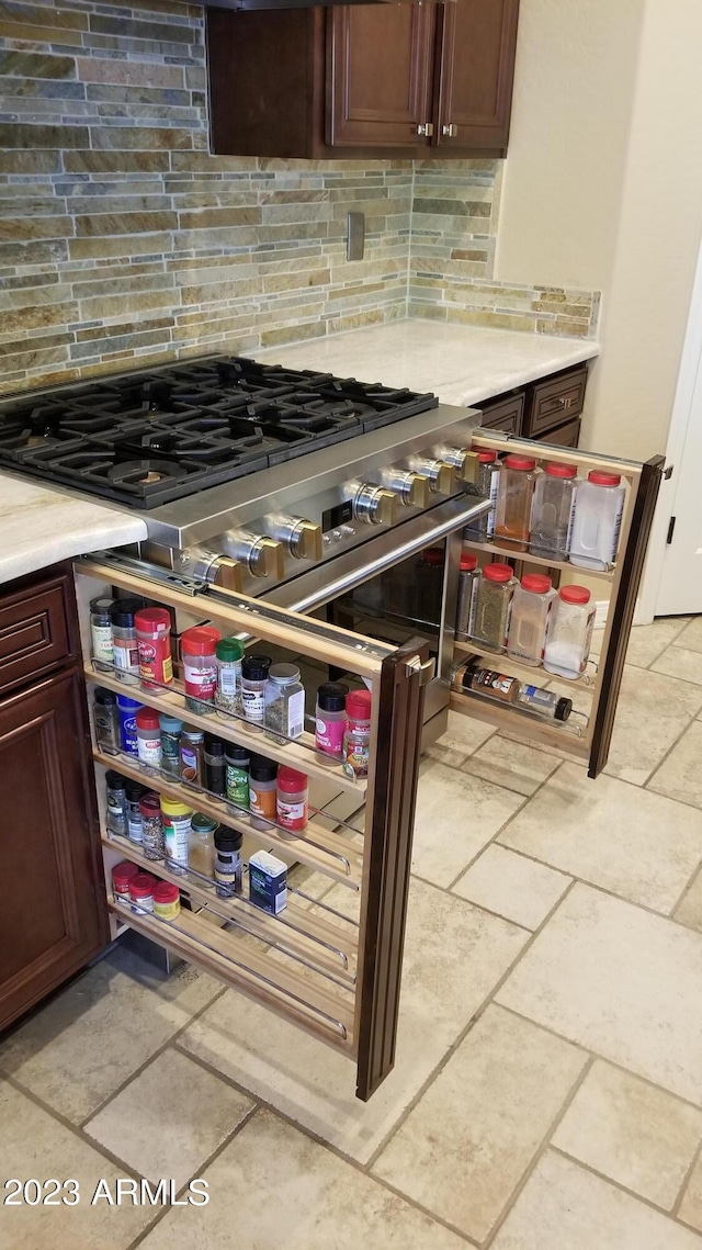 kitchen with light countertops and tasteful backsplash