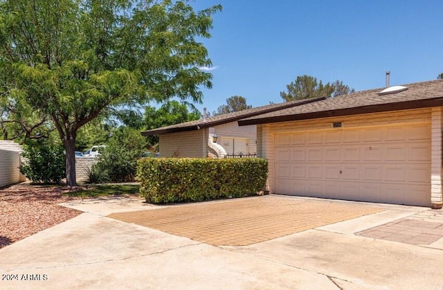 view of side of home featuring a garage