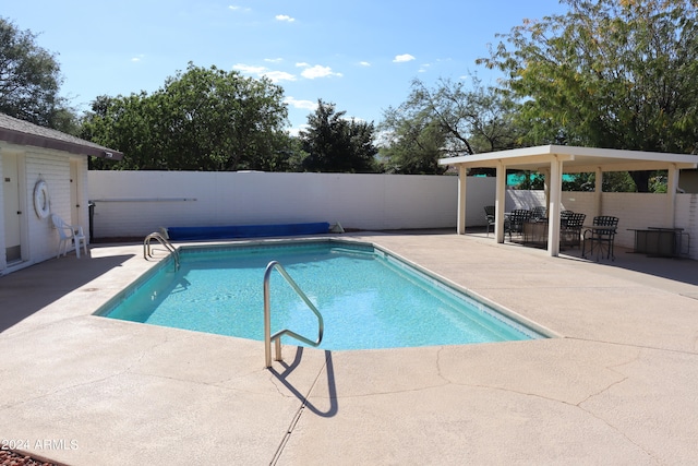 view of swimming pool with a patio area