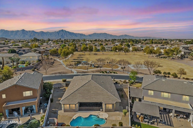 aerial view at dusk with a mountain view