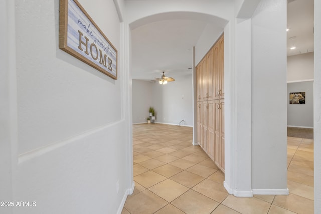 hallway with light tile patterned floors