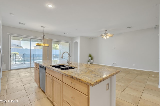 kitchen with sink, dishwasher, a kitchen island with sink, decorative light fixtures, and light brown cabinets