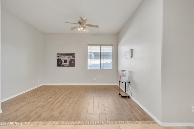 unfurnished room featuring ceiling fan and light wood-type flooring