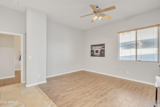 empty room with light hardwood / wood-style flooring and ceiling fan