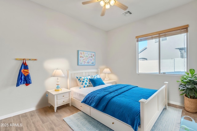 bedroom featuring ceiling fan and light hardwood / wood-style floors