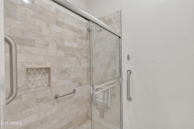 bathroom featuring an enclosed shower