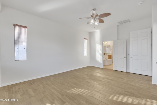 empty room with light hardwood / wood-style floors and ceiling fan