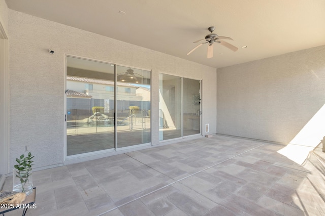 view of patio featuring ceiling fan