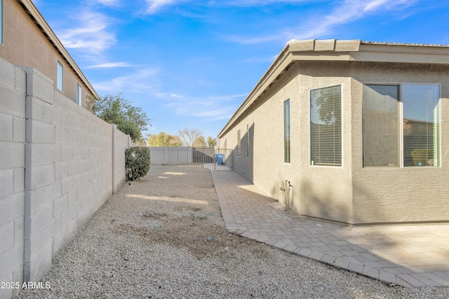 view of property exterior featuring a patio area