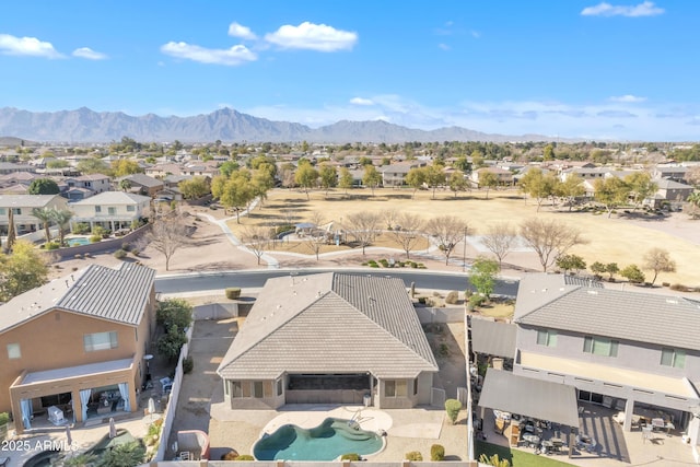 birds eye view of property with a mountain view