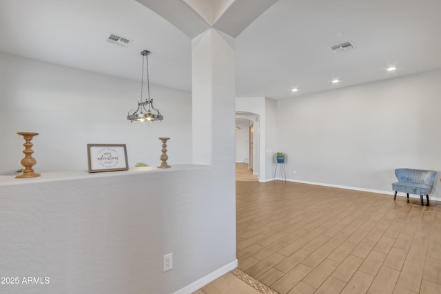 hallway with light wood-type flooring