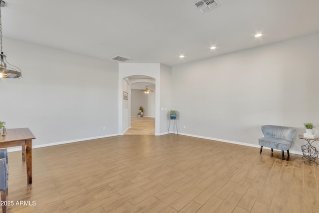 interior space featuring ceiling fan and light wood-type flooring