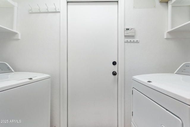 clothes washing area with laundry area and separate washer and dryer