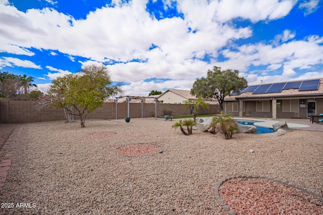 view of yard featuring a fenced in pool, a fenced backyard, and a patio