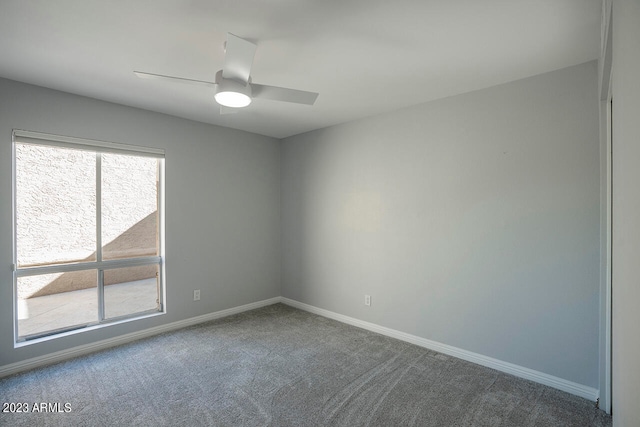 unfurnished room featuring ceiling fan, a healthy amount of sunlight, and carpet flooring