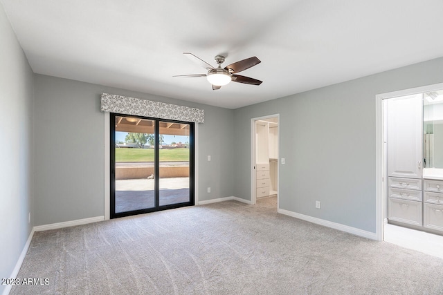 carpeted empty room with ceiling fan