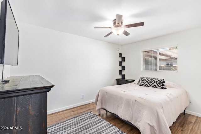 bedroom featuring dark wood-type flooring and ceiling fan