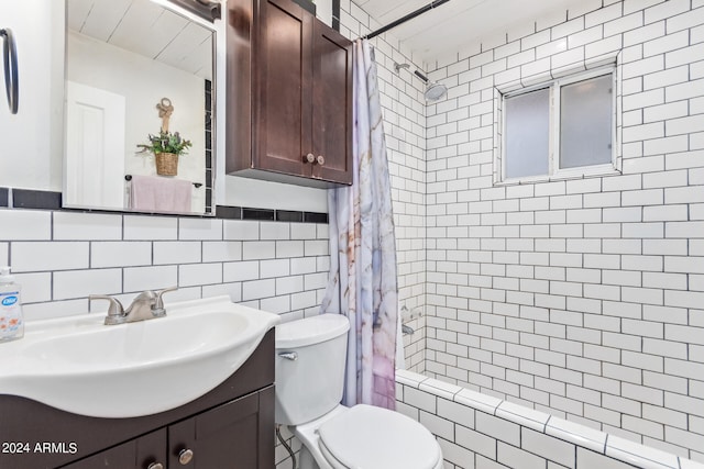 bathroom featuring tile walls, tasteful backsplash, vanity, and toilet