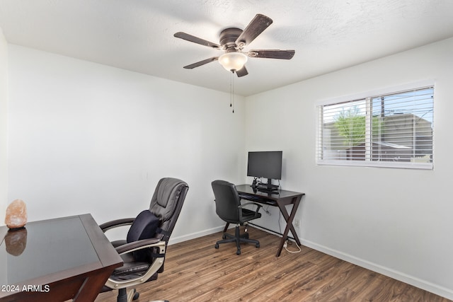 office with ceiling fan and hardwood / wood-style flooring